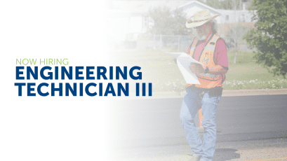 Moore Engineering. Man walking toward camera in construction outfit. Now hiring Engineering Technician III. Minot, North Dakota