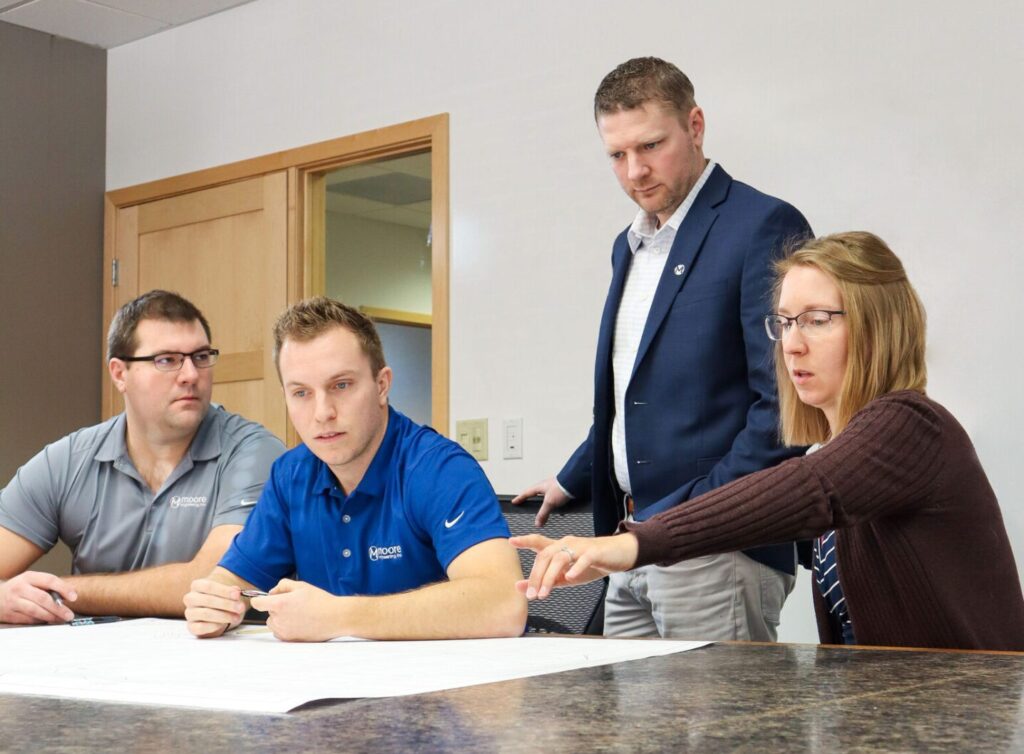 Bismarck, ND- Moore Engineering Employees in conference room 1
